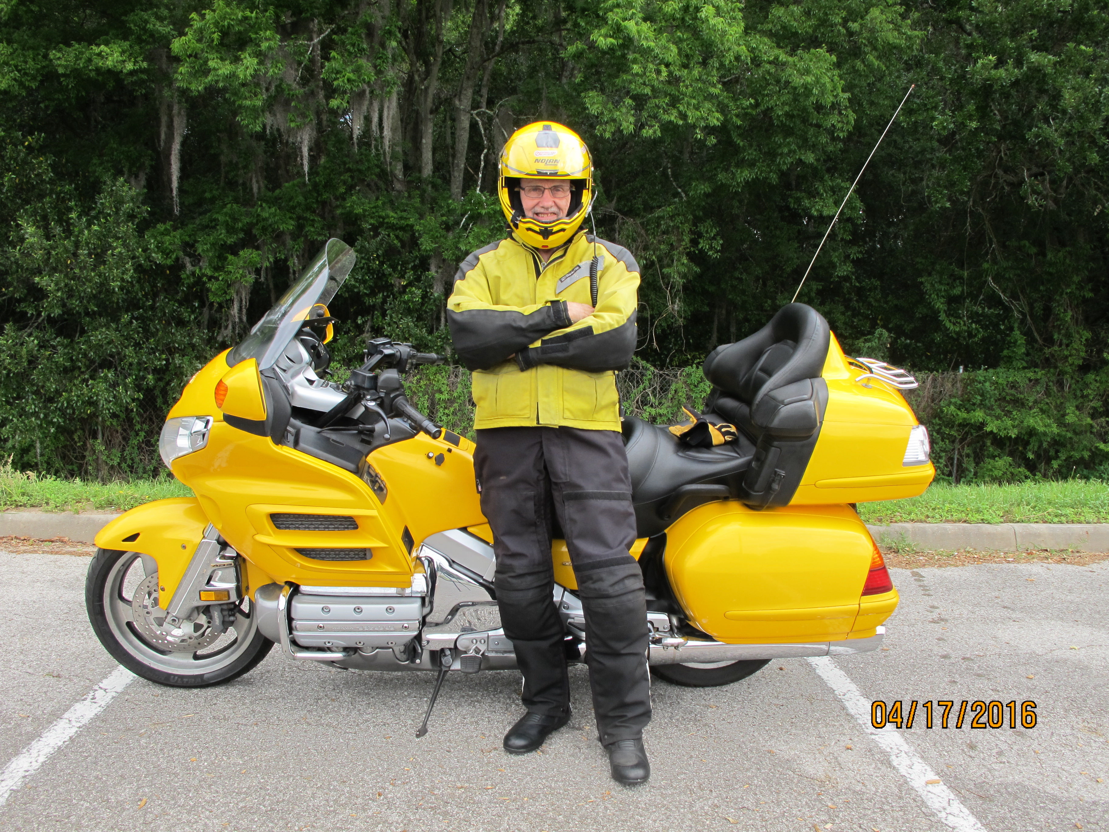 Paul in riding gear atanding next to his Goldwing